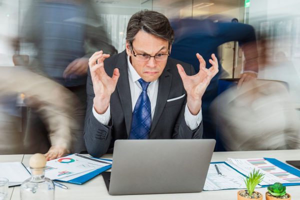 frustrated man viewing laptop